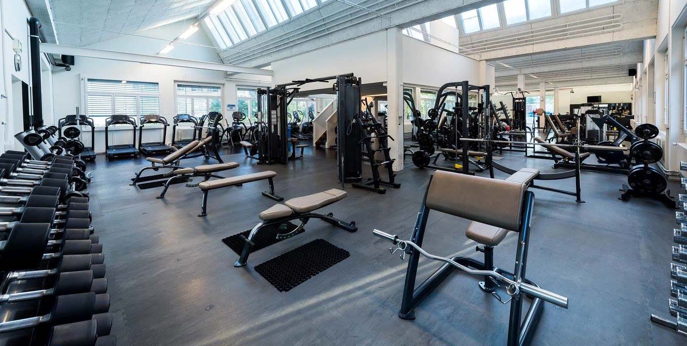 Gym Interior view with weights, gym equipment and Rubber Gym Floors