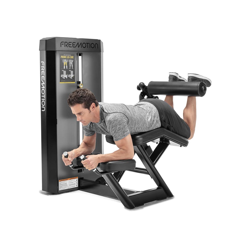 Freemotion Epic Selectorized -Prone Leg Curl, glute workouts, leg workouts, gym fitness equipment, exercises at the gym, workout, exercises with prone leg curl.