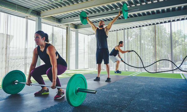 People working-out on a Rubber Gym Floor - Guide for Choosing the Right Thickness for Rubber Gym Floors 