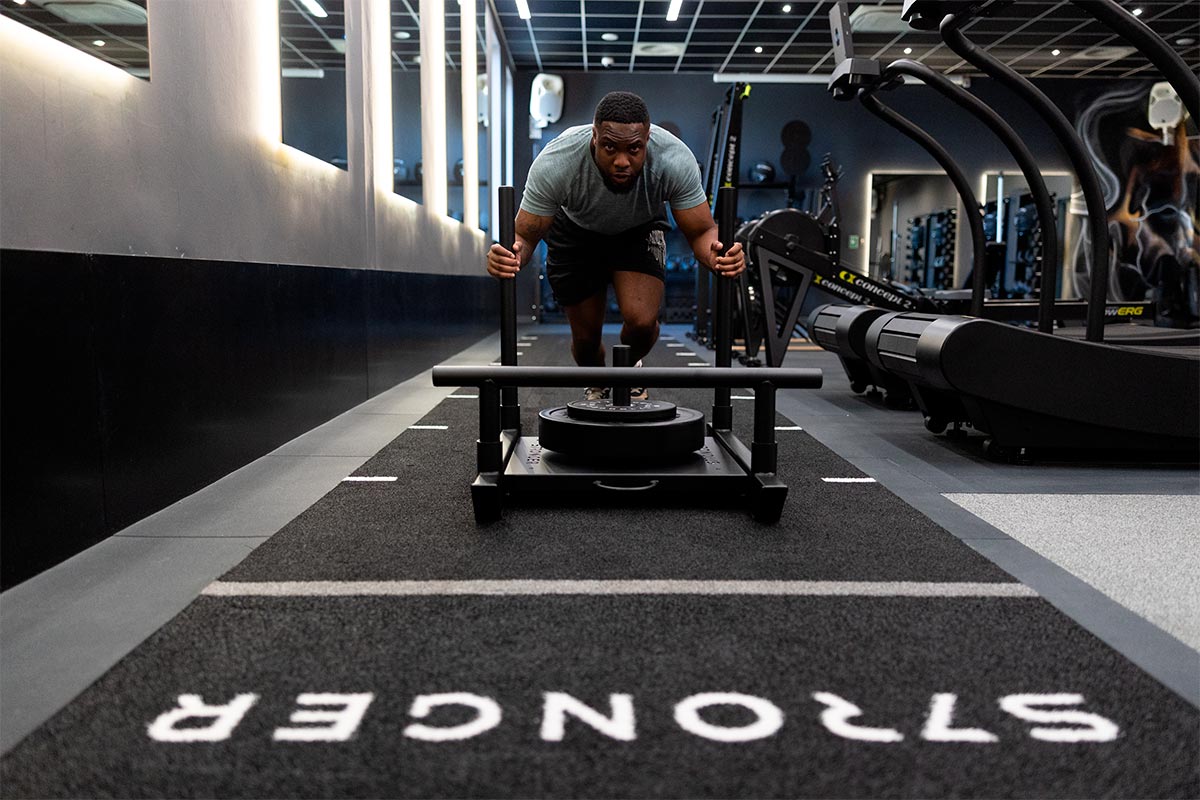 Interior gym design with gym sled workout